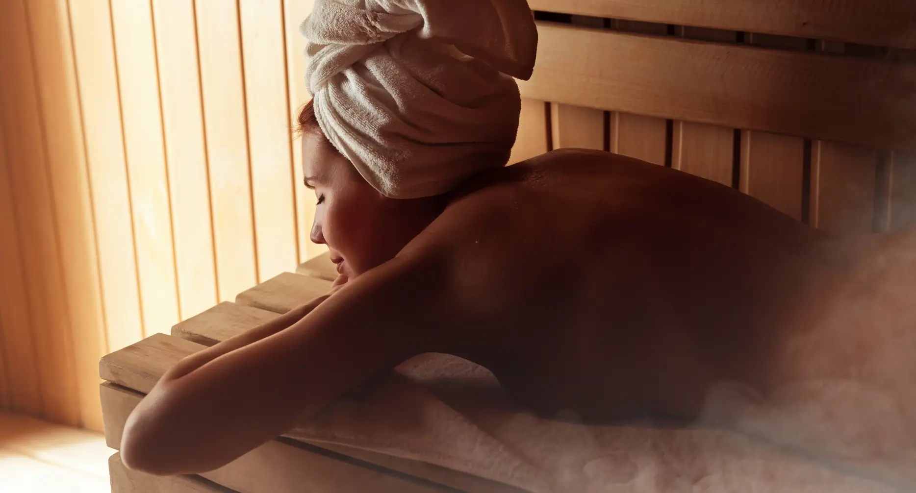 Lady relaxing in herbal sauna